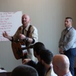 a corporate group having fun in a songwriting session