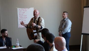 a corporate group having fun in a songwriting session