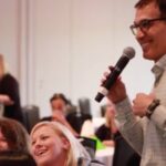 People laughing during a speech