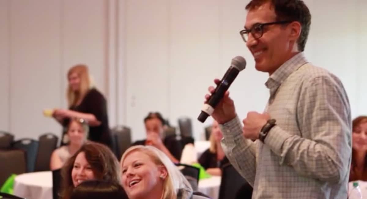 People laughing during a speech