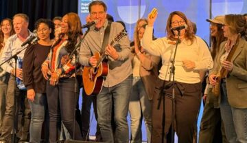 a team building group performing the song they wrote
