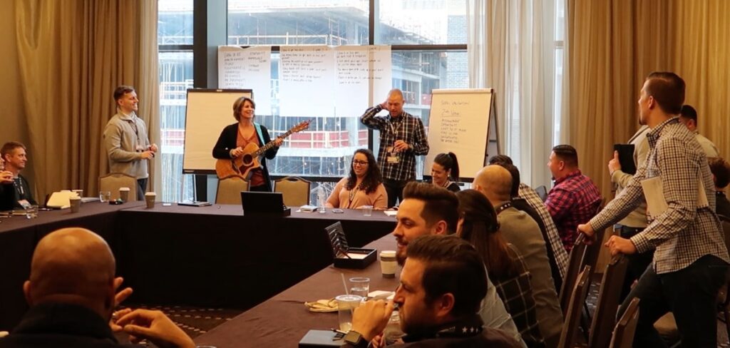 a group using music for a team building activity