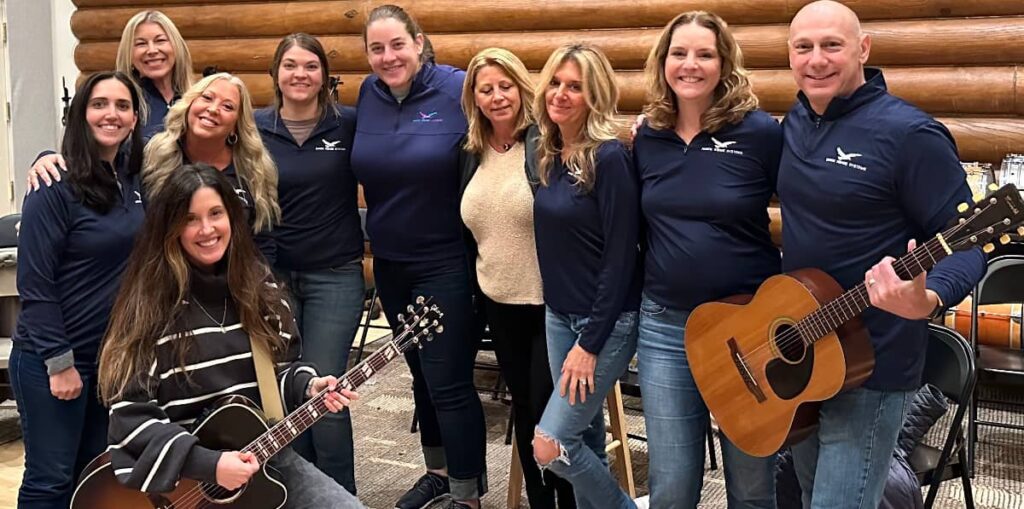 a group with guitars at a team building session