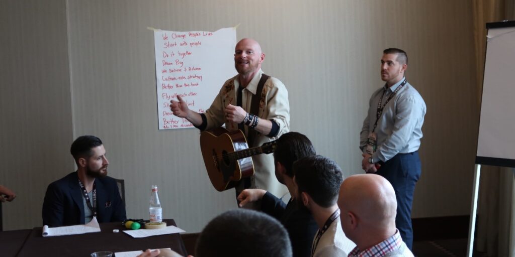 a group having fun with music team building
